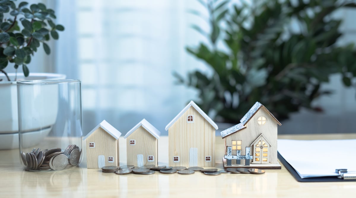 Real estate investment concept with virtual screen showing property transactions, home sale online