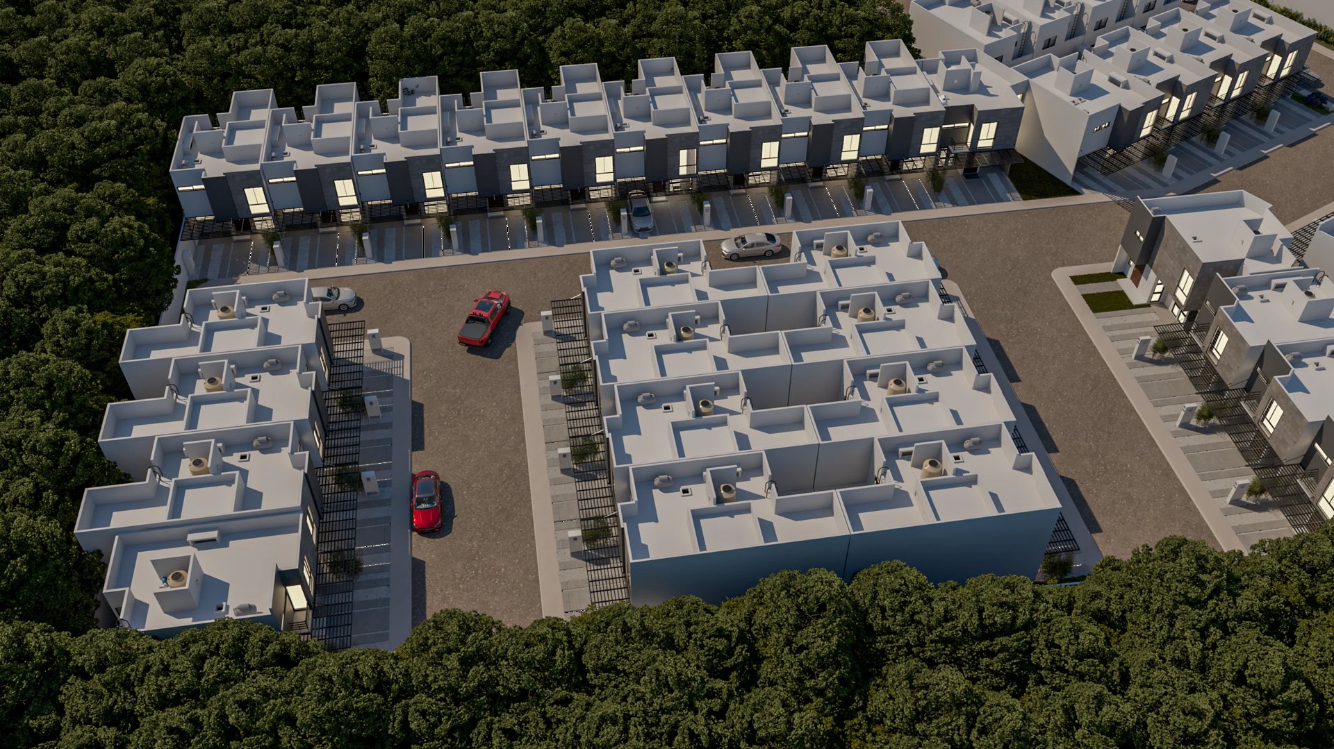 Aerial view of a residential townhouse development with multiple attached units, parking areas, and surrounding green landscape